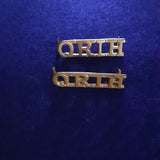 Original pair of brass shoulder titles the Queen's Royal Irish Hussars (QRIH)